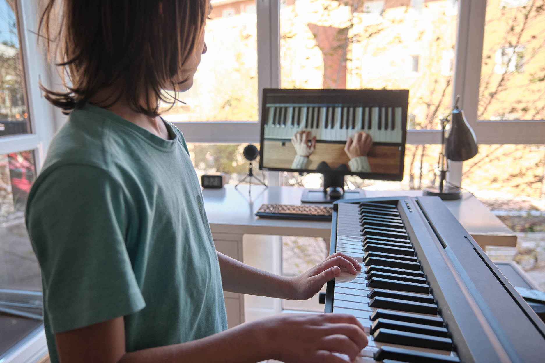 Young Boy Having an Online Piano Class